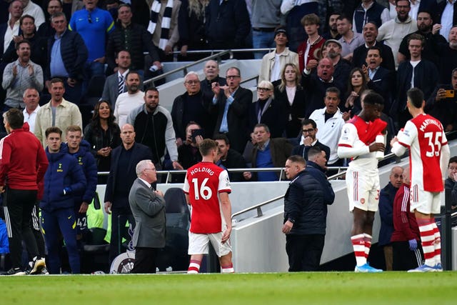 Arsenal’s Rob Holding leaves the pitch after his red card