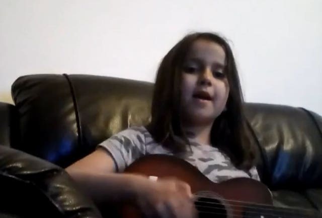 Undated handout video grab image issued by Surrey Police of Sara Sharif, 10, singing and playing a guitar