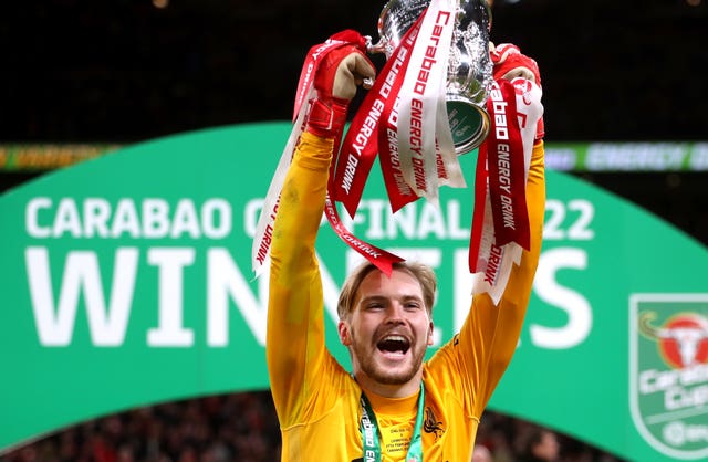 Caoimhin Kelleher celebrates with the trophy