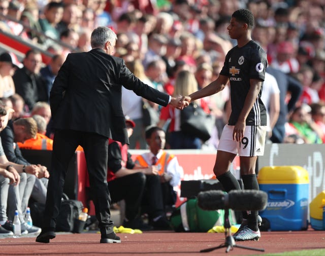 Manchester United manager Jose Mourinho shakes hands with Marcus Rashford