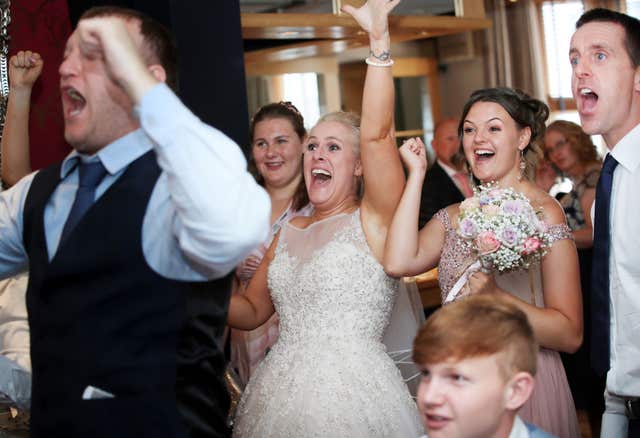 Bride watches England game