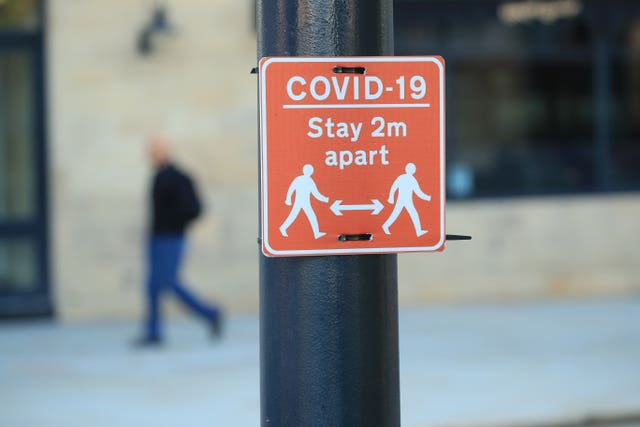 A sign advising people to stay two metres apart