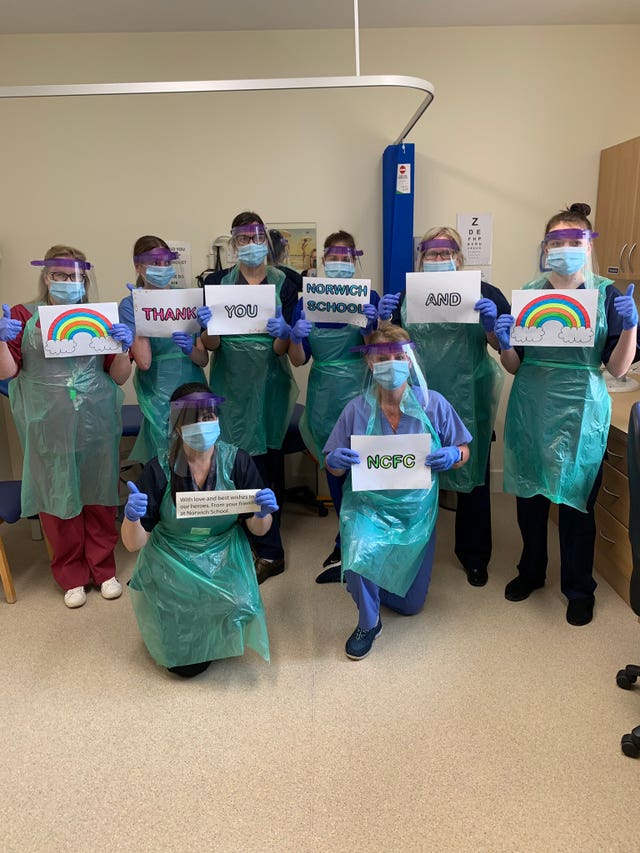 Staff wearing visors made by the school at Norfolk and Norwich Hospital