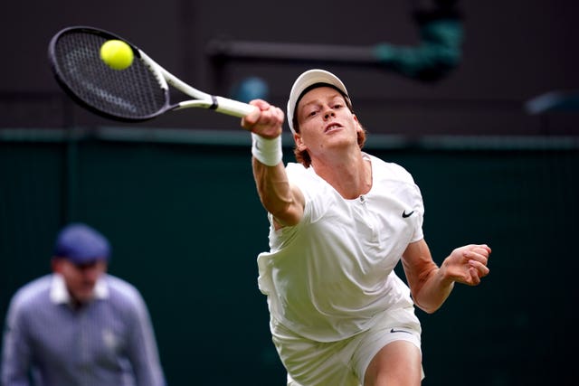 Jannik Sinner stretches to reach a shot during his straight-sets win over Roman Safiullin. The 21-year-old Italian became the youngest man to reach the last four of Wimbledon since 2007 - a record that will last only until Wednesday when world number one Carlos Alcaraz faces fellow 20-year-old Holger Rune