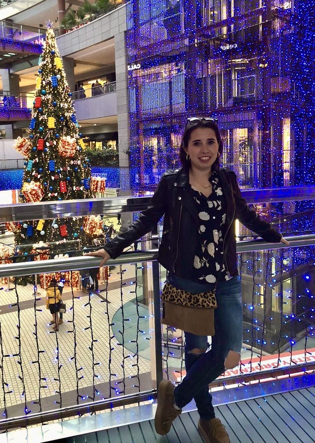 Handout photo of Marta Elena Vento smiling in front of a Christmas tree