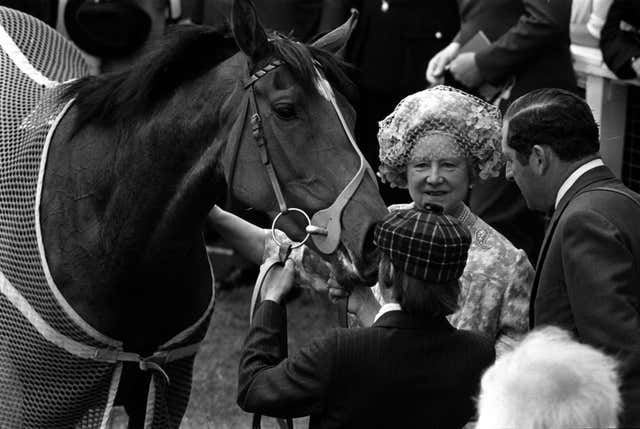 Dunfermline gets a pat from the Queen Mother after winning the Oaks at Epsom 