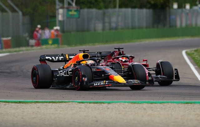 Max Verstappen (left) overtakes Ferrari's Charles Leclerc