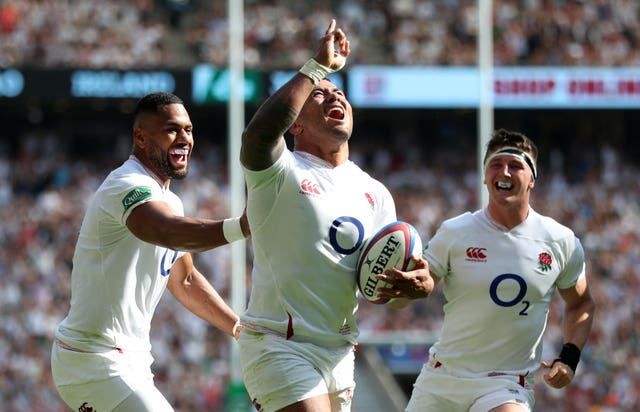 Manu Tuilagi celebrates his third try against Ireland