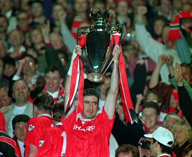 Manchester United's Eric Cantona lifts the Premier League trophy at the end of the 1992-93 season
