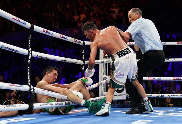 Wood, centre, dramatically stopped Conlan in the final round of their fight (Zac Goodwin/PA)