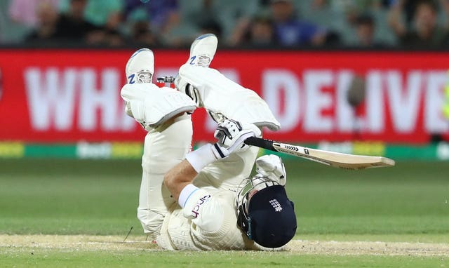 England captain Joe Root hits the floor after being struck in the groin by Mitchell Starc.