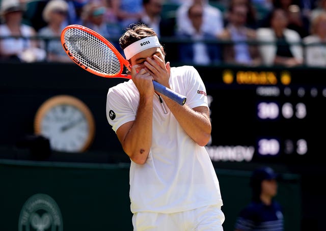 Taylor Fritz puts his hands over his face