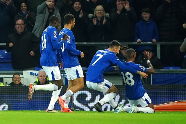 Everton’s Ashley Young slides on his knees to celebrate scoring against Wolves at Goodison Park