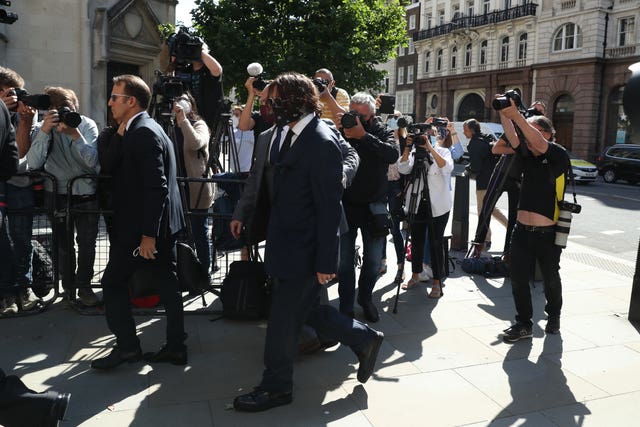 Actor Johnny Depp, centre, arriving at the High Court in London