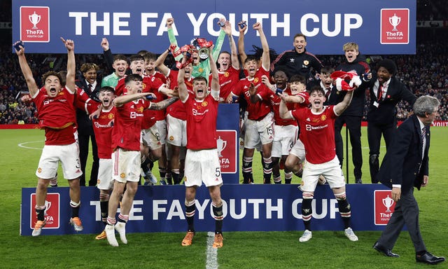 Rhys Bennett lifts the FA Youth Cup at Old Trafford in 2022