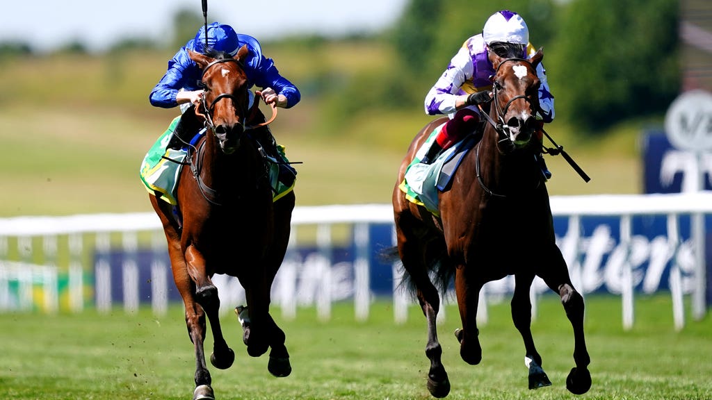 Mawj ridden by jockey Ray Dawson (left) on their way to winning the Duchess Of Cambridge Stakes on Festival Friday of the Moet and Chandon July Festival at Newmarket