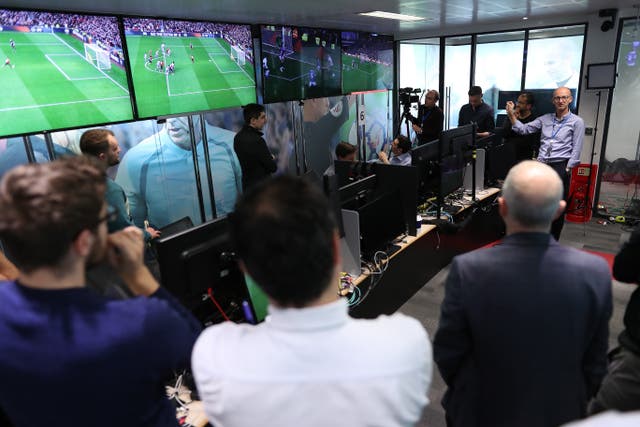 Mike Riley, right, gives a pre-season briefing to media on the use of VAR