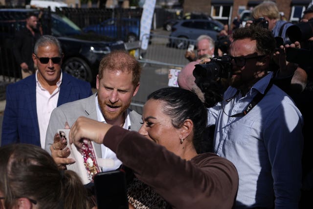 Harry poses for selfies after his visit in Nottingham