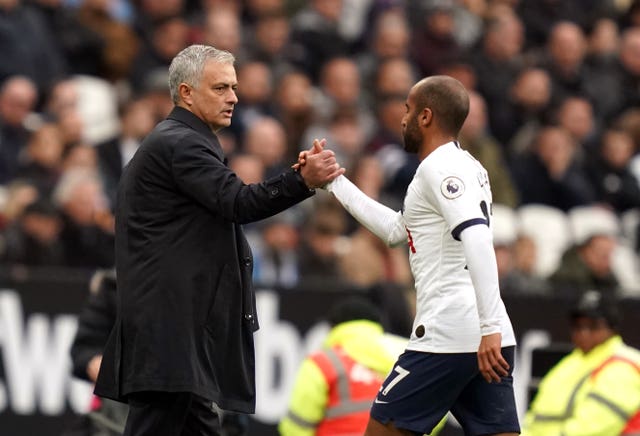 Mourinho (left) shakes hands with Moura as he is substituted at West Ham