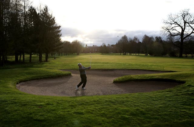 Paul Lambert plays from a bunker by the first green at Vale Royal Abbey Golf Club