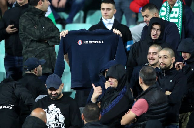 Bulgaria fans display a sweatshirt with the words No Respect in the stands 