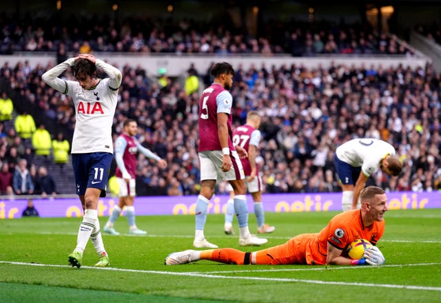 Aston Villa goalkeeper Robin Olsen saves a shot from Tottenham's Bryan Gil