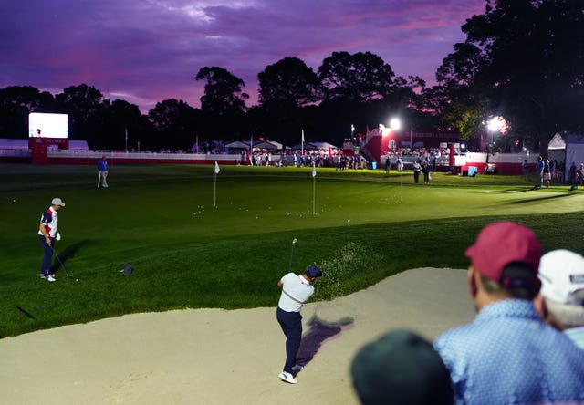 Jon Rahm takes a practice shot