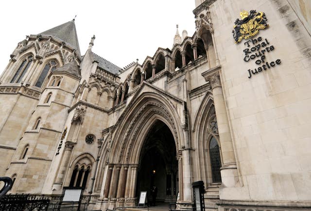 The arched entrance of the High Court on The Strand in London