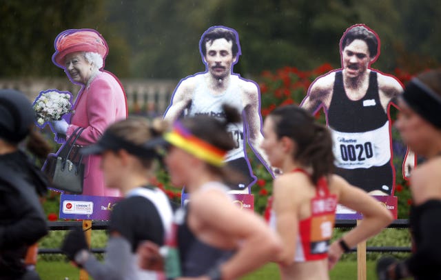 Cardboard cut-outs stood in for the usual crowds lining the marathon route - among them former competitors and the Queen