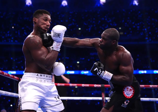 Daniel Dubois, right, punching Anthony Joshua 