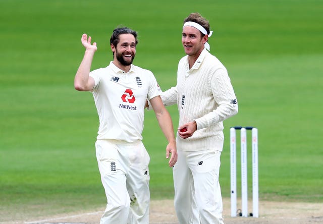 England's Chris Woakes and Stuart Broad celebrate taking a wicket