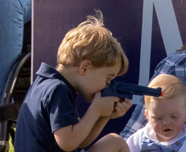 Prince George plays with a toy gun