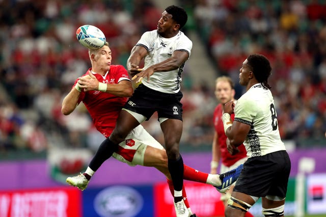 Wales’ Liam Williams (left) and Fiji’s Frank Lomani battle for the ball