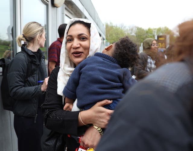 People evacuated from Sudan arrive on a flight from Cyprus into Stansted Airport in Essex