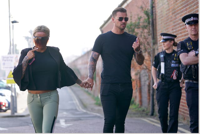 Carl Woods arrives at Colchester Magistrates’ Court, Essex, alongside partner Katie Price (Joe Giddens/PA)