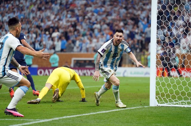 Lionel Messi celebrates scoring his sides third goal 