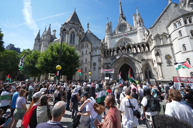 Protesters outside the Royal Courts of Justice on The Strand