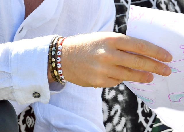 The Duke of Sussex, wearing a bracelet with the word ‘justice’