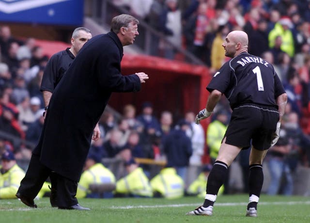 Manchester United boss Sir Alex Ferguson gives instructions to Fabien Barthez