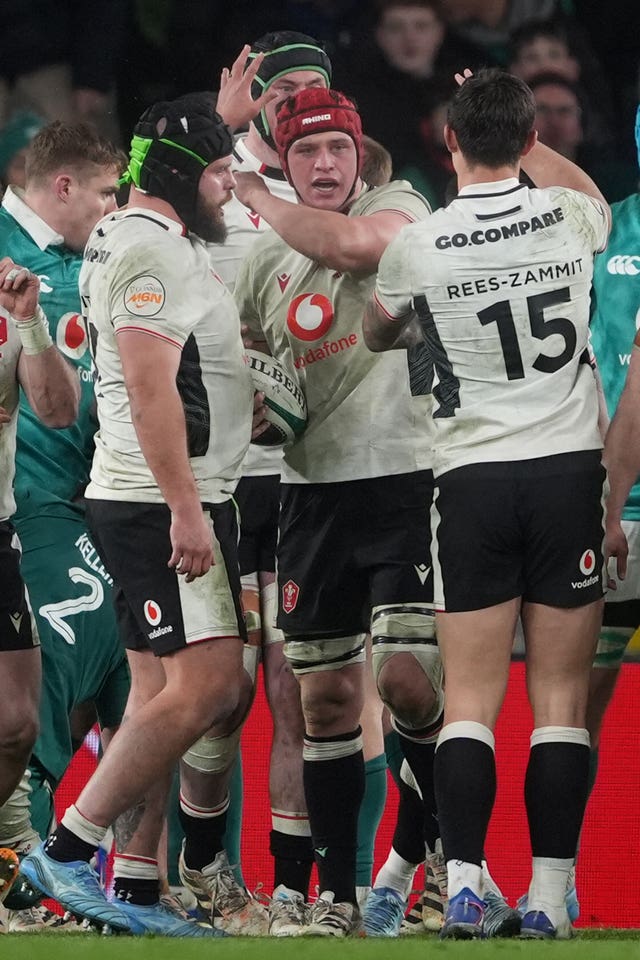 Wales’ James Botham (centre) celebrates