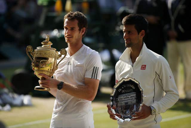 Andy Murray, left, with the trophy and Novak Djokovic with the runner-up's plate after the 2013 Wimbledon final