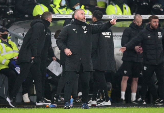 Wayne Rooney's Derby are bottom of the Championship, 11 points from safety, after being docked 21 points (Nigel French/PA).