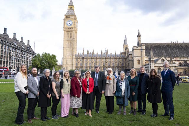 Scottish Liberal Democrat MP Christine Jardine (6th left), Labour MP Kim Leadbeater (7th left) and Conservative MP Kit Malthouse (8th left) join terminally ill advocates, bereaved families, and campaigners for a photocall outside the House of Parliament