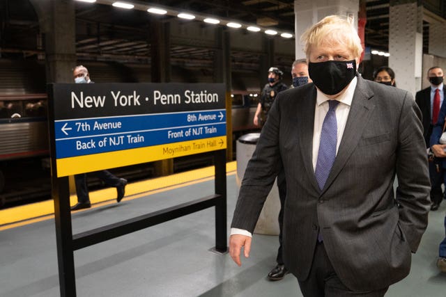 Prime Minister Boris Johnson prepares to board a train from Penn Station in New York to Washington DC (Stefan Rousseau/PA)