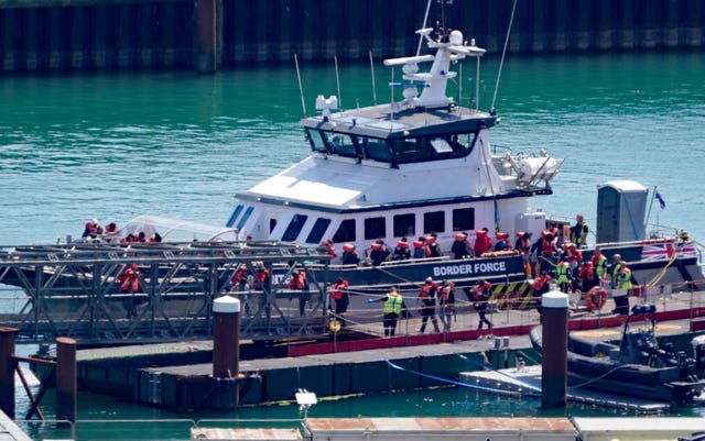 A group of people thought to be migrants are brought in to Dover from a Border Force vessel 