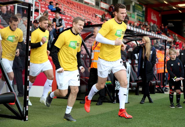 Kevin Long leads out the Burnley team in Kick It Out T-shirts