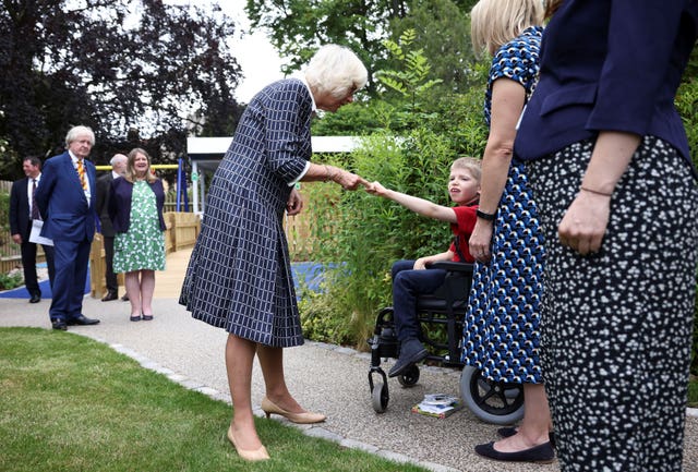 The Duchess of Cornwall meets Kim O’Grady and her son Toby, seven, during a visit to the Helen & Douglas House children’s hospice in Oxford