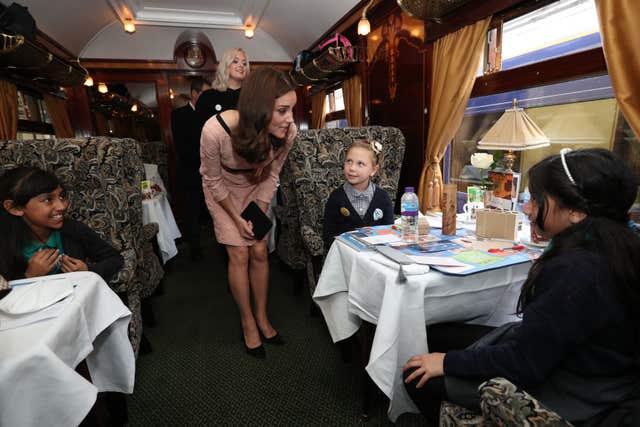 Kate chats to children onboard the Belmond British Pullman train during a Charities Forum event. Jonathan Brady/PA Wire