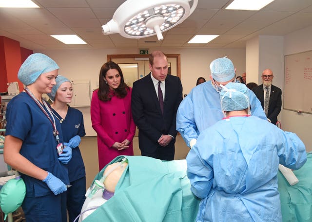 The Duke and Duchess of Cambridge speak to staff as they tour the Science and Health Building at Coventry University (Eamonn M McCormack/PA)