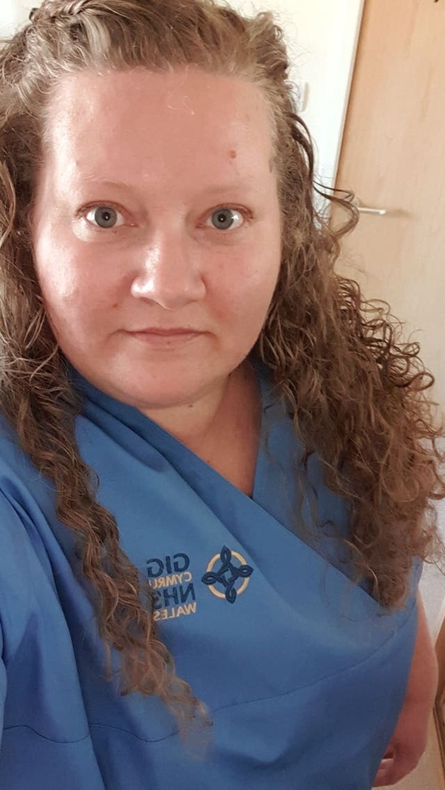 Joanne Hill in her nurse scrubs